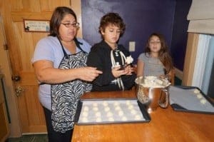 Holly Costa with her children, Jacob and Isabella, baking cookies