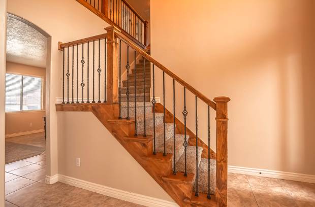 A beautiful newly renovated home with an updated stair handrail to ensure family safety and well-being.